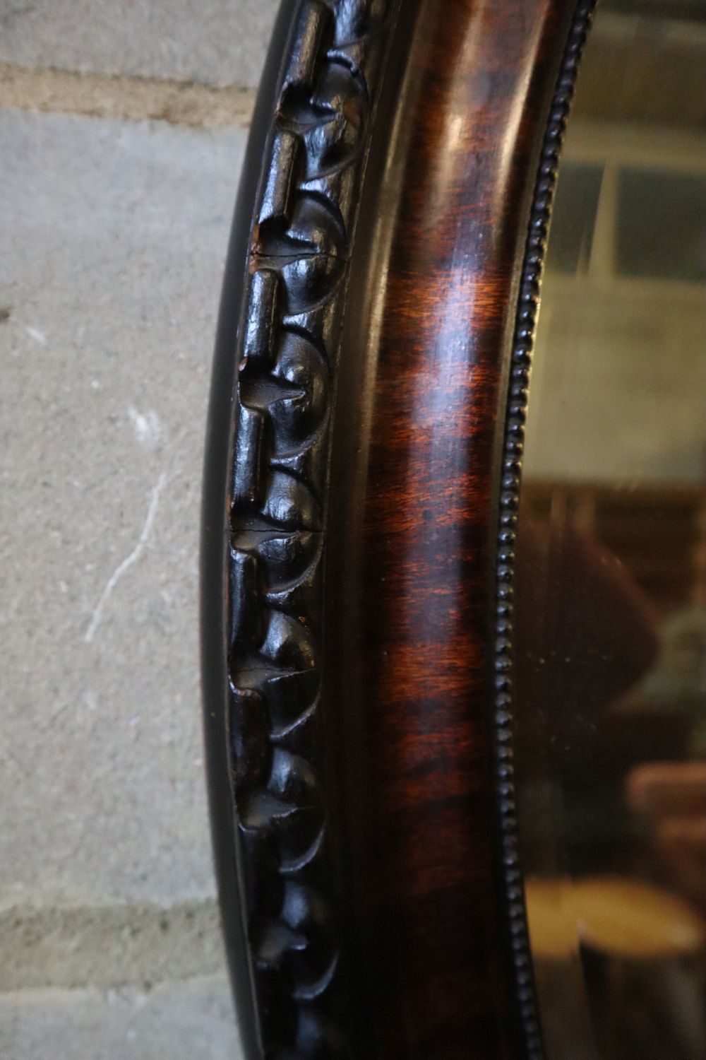 An early 20th century oval wall mirror, height 88cm